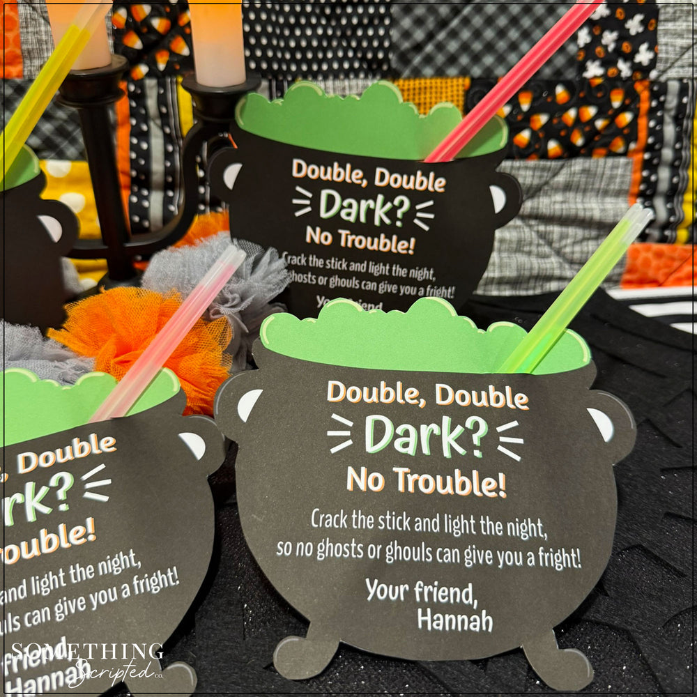 
                  
                    paper cauldron party favors with glow sticks sticking out of them

                  
                